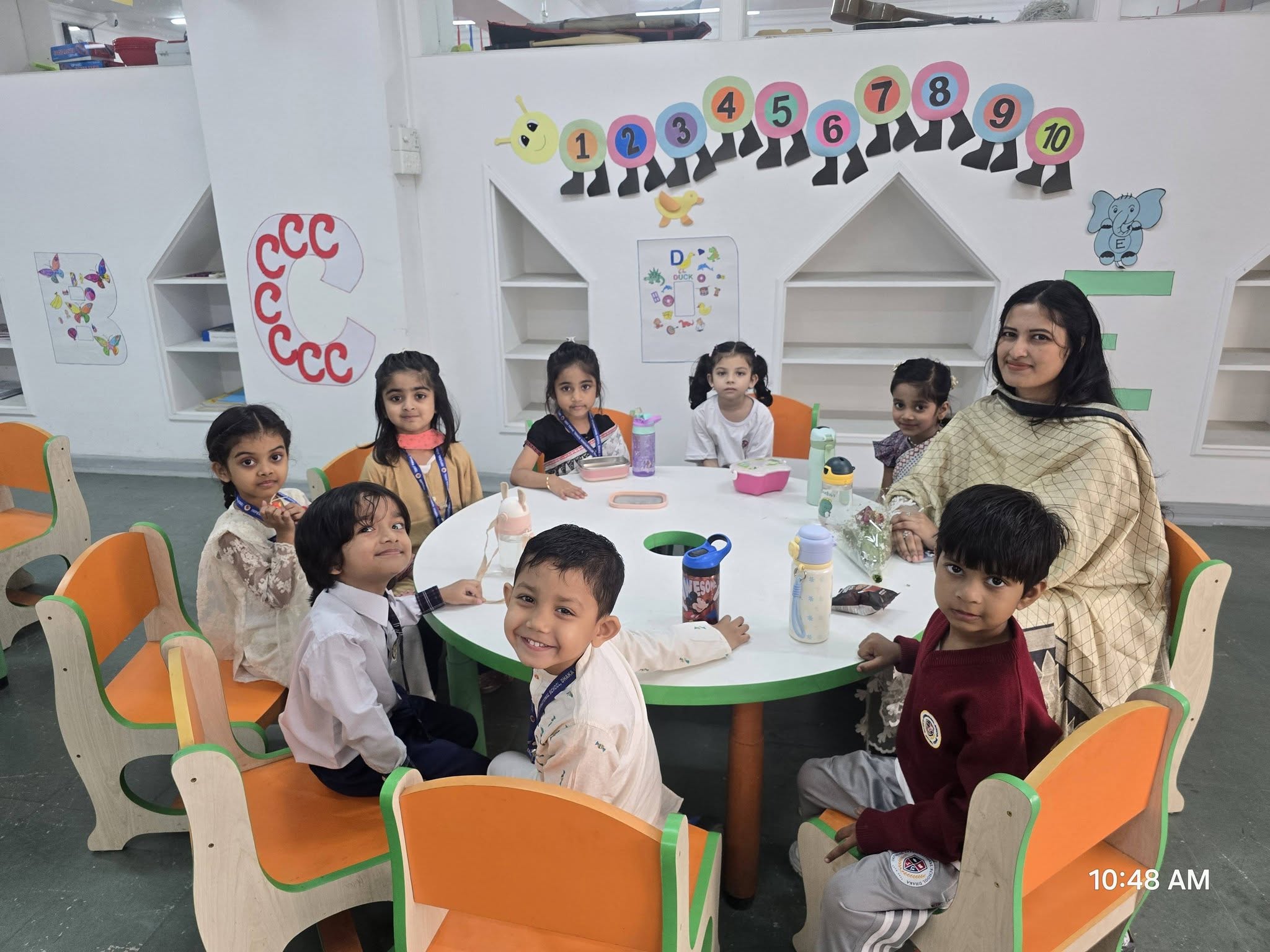 Young students and teacher in the early years classroom